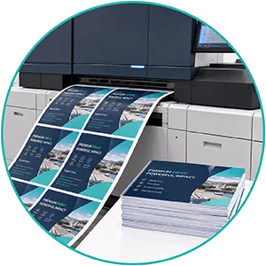 Professional digital print production with printed sheets and finished print materials at Print-Tag